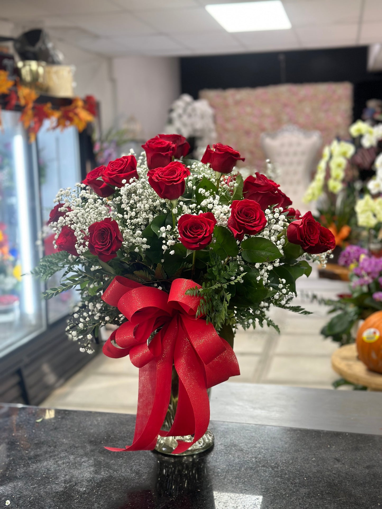 24 red roses in a vase