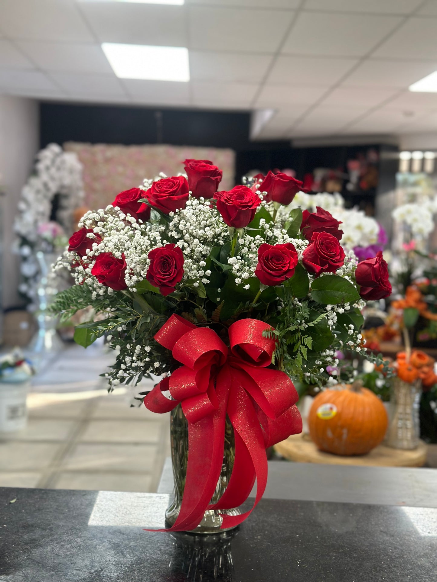 24 red roses in a vase